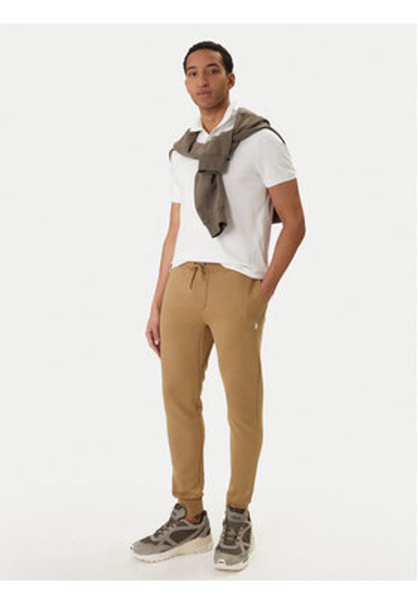 Polo Ralph Lauren Spodnie dresowe 710881518502 Beżowy Regular Fit. Kolor: beżowy. Materiał: syntetyk, bawełna