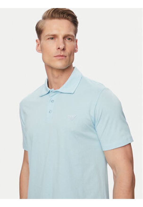Emporio Armani Polo EM000571 AF20424 U9242 Niebieski Regular Fit. Typ kołnierza: polo. Kolor: niebieski. Materiał: bawełna