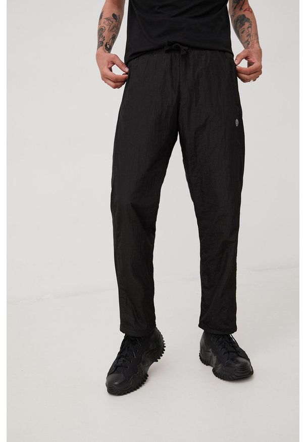 Unfair Athletics spodnie męskie kolor czarny gładkie. Kolor: czarny. Materiał: tkanina. Wzór: gładki