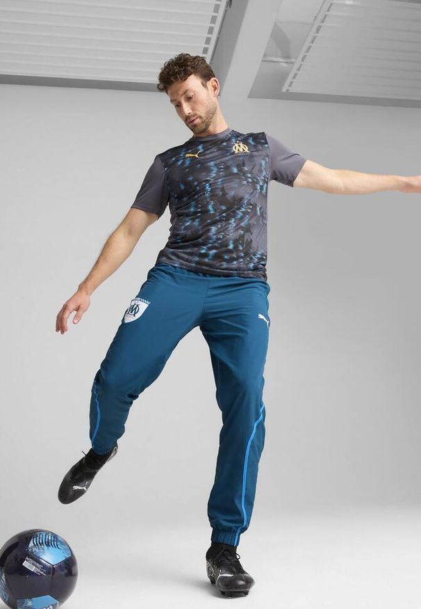 Puma - Męska koszulka przedmeczowa Olympique de Marseille PUMA. Kolor: wielokolorowy, beżowy, szary