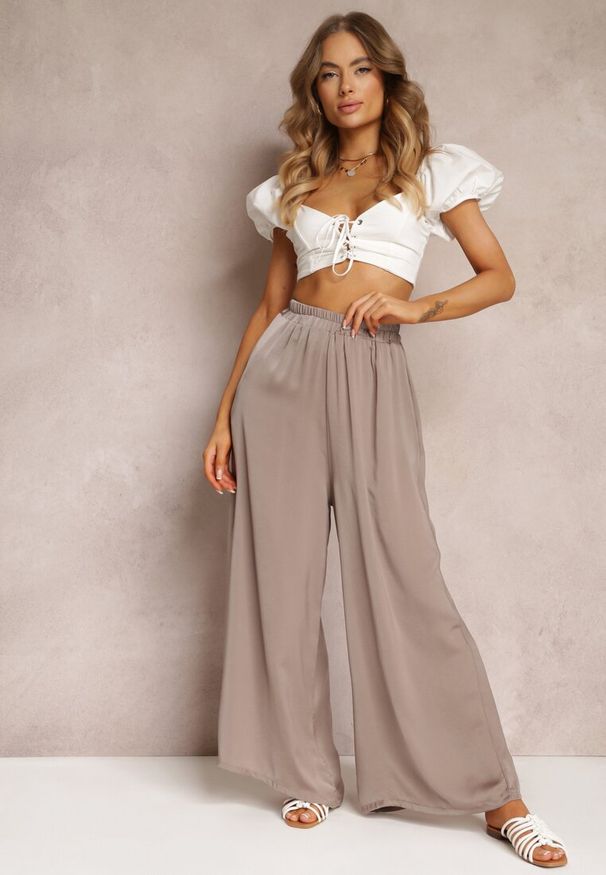 Renee - Ciemnobeżowe Spodnie z Szerokimi Nogawkami i Gumką w Pasie Jacobisa. Stan: podwyższony. Kolor: beżowy