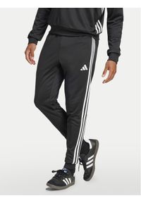 Adidas - adidas Spodnie dresowe Tiro 25 Essentials Sweat JC5464 Czarny Regular Fit. Kolor: czarny. Materiał: syntetyk #1