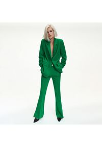 Reserved - Spodnie flare - Zielony. Kolor: zielony #1