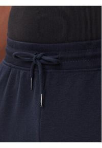 TOMMY HILFIGER - Tommy Hilfiger Spodnie dresowe UM0UM03664 Granatowy Regular Fit. Kolor: niebieski. Materiał: bawełna