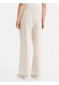 TOMMY HILFIGER - Tommy Hilfiger Spodnie dresowe UW0UW06180 Beżowy Wide Leg. Kolor: beżowy. Materiał: bawełna #2