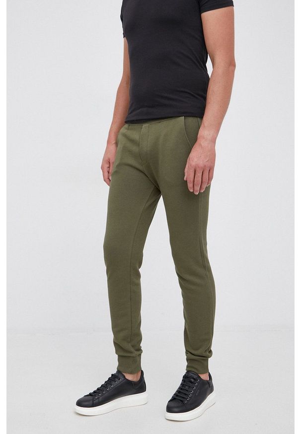 United Colors of Benetton Spodnie męskie kolor zielony gładkie. Kolor: zielony. Materiał: dzianina. Wzór: gładki