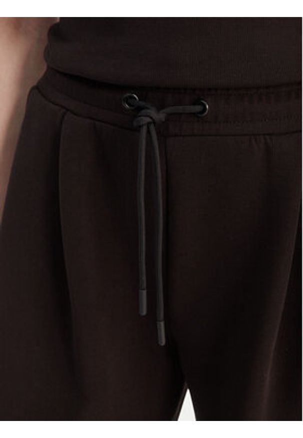 Guess Spodnie dresowe V6GB01 K2914 Brązowy Wide Leg. Kolor: brązowy. Materiał: syntetyk