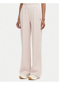 Guess Spodnie dresowe V6YB18 K4315 Różowy jasny Regular Fit. Kolor: różowy. Materiał: syntetyk #1