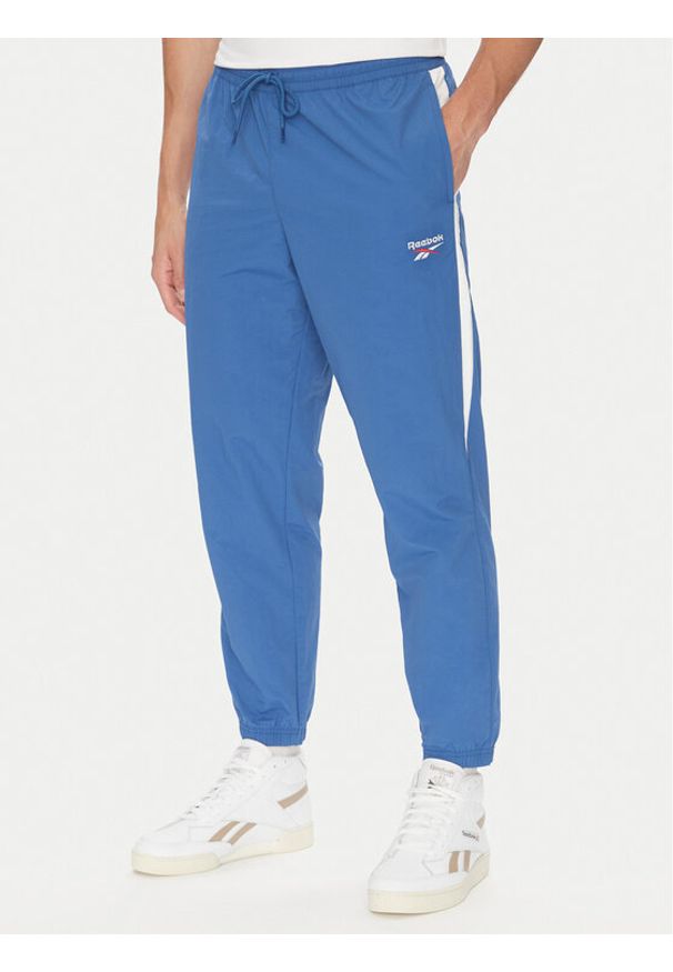 Reebok Spodnie dresowe 100215278 Niebieski Regular Fit. Kolor: niebieski. Materiał: syntetyk