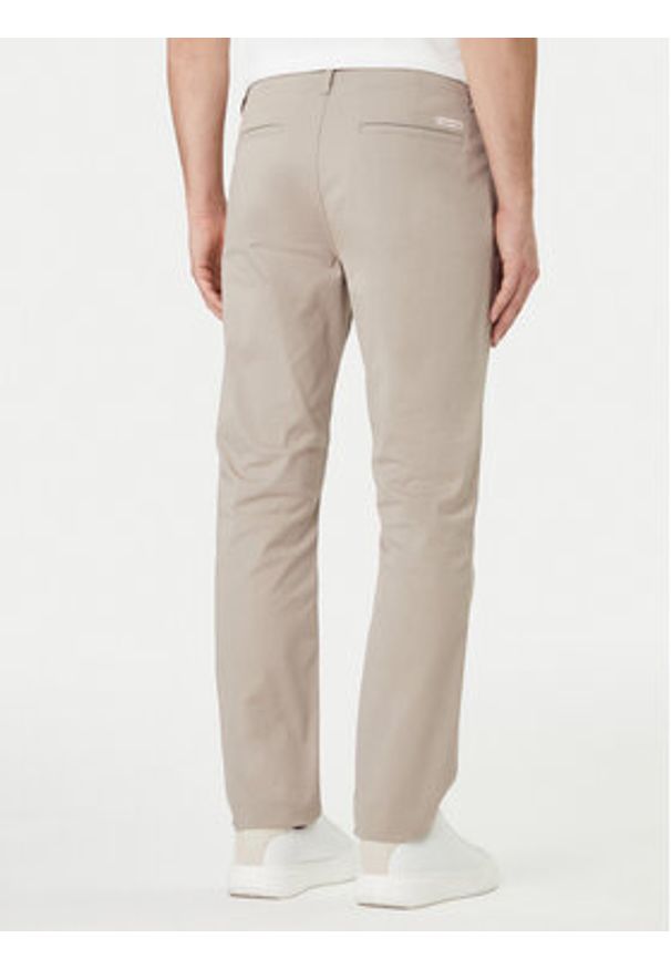 Calvin Klein Jeans Spodnie materiałowe LV04RF618G Beżowy Slim Fit. Kolor: beżowy. Materiał: bawełna