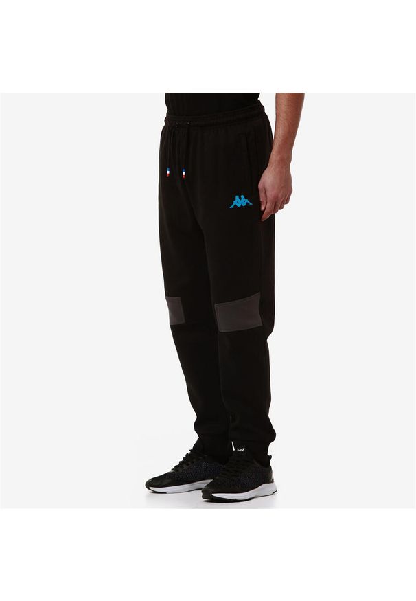 Kappa - Spodnie dresowe Alpine F1 Adrofin 2024. Kolor: wielokolorowy, niebieski, czarny. Materiał: dresówka. Długość: długie. Sport: bieganie