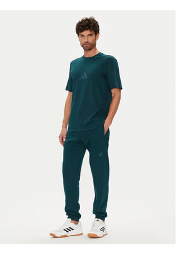 Adidas - adidas Spodnie dresowe ALL SZN Fleece JX5096 Zielony Tapered Leg. Kolor: zielony. Materiał: bawełna