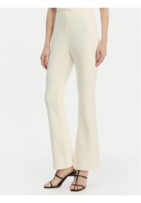 Calvin Klein Spodnie materiałowe LV044B223G Beżowy Flare Fit. Kolor: beżowy. Materiał: syntetyk #1