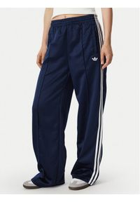 Adidas - adidas Spodnie dresowe Satin Sst Loose Trackpant KS7339 Granatowy Relaxed Fit. Kolor: niebieski. Materiał: syntetyk #1