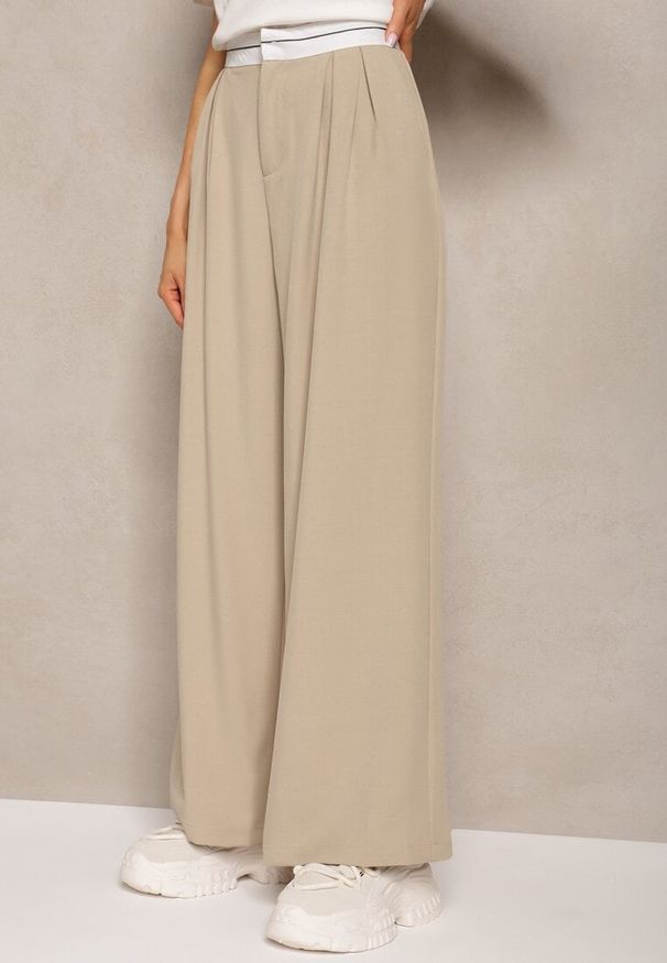 Renee - Beżowe Spodnie z Wiskozy Palazzo High Waist Zapinane na Suwak Nellieva. Okazja: na co dzień. Stan: podwyższony. Kolor: beżowy. Materiał: wiskoza. Styl: casual