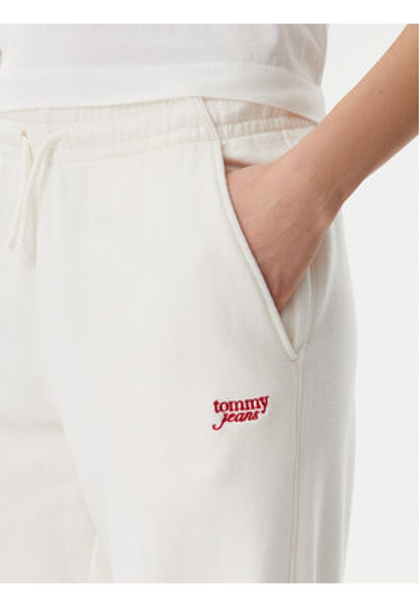 Tommy Jeans Spodnie dresowe Script DW0DW20670 Écru Relaxed Fit. Materiał: bawełna