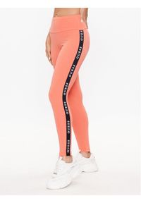 Guess Legginsy V2YB14 KABR0 Pomarańczowy Slim Fit. Kolor: pomarańczowy. Materiał: syntetyk, bawełna