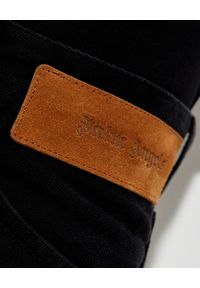 PALM ANGELS - Czarne jeansy z logo. Kolor: czarny. Długość: długie. Wzór: aplikacja, nadruk. Styl: klasyczny #6