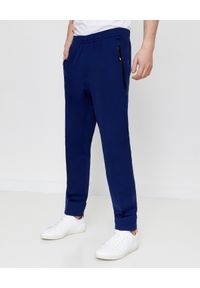 MONCLER - Granatowe spodnie. Kolor: niebieski. Materiał: bawełna. Wzór: gładki