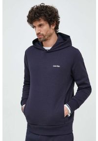 Calvin Klein bluza męska kolor granatowy z kapturem gładka. Typ kołnierza: kaptur. Kolor: niebieski. Materiał: dzianina. Wzór: gładki #1