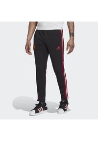 Adidas - Manchester United DNA 3-Stripes Pants. Kolor: czarny. Materiał: dresówka #1