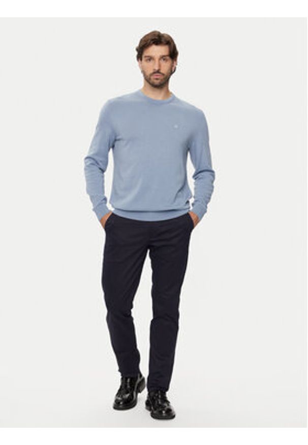 Calvin Klein Chinosy K10K113429 Granatowy Slim Fit. Kolor: niebieski. Materiał: bawełna