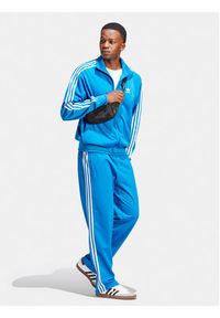 Adidas - adidas Spodnie dresowe adicolor Classics Firebird IJ7056 Niebieski Regular Fit. Kolor: niebieski. Materiał: syntetyk #6