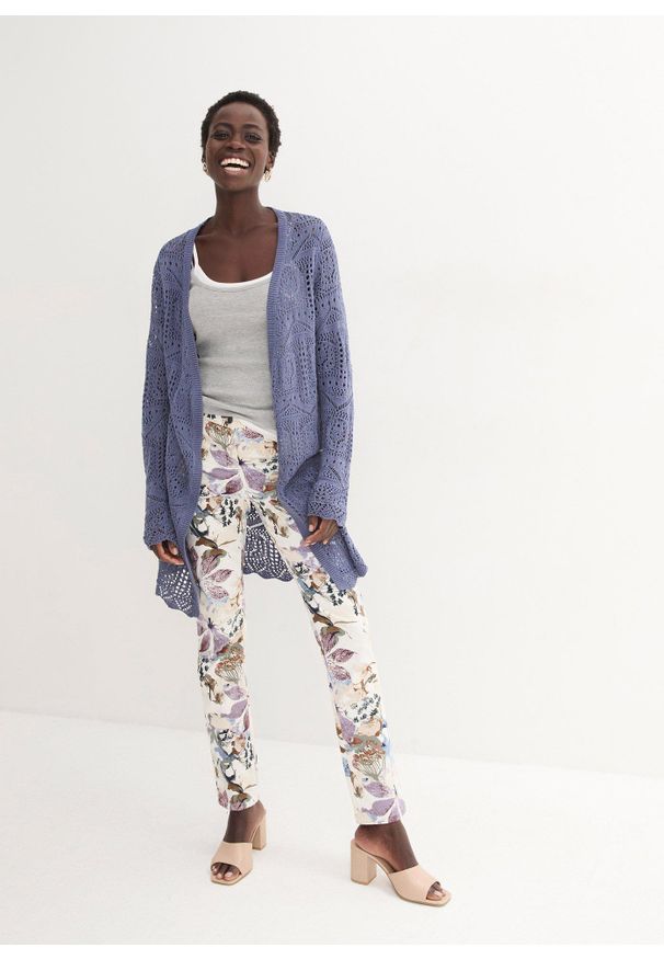 bonprix - Spodnie ze stretchem w kwiaty. Kolor: beżowy. Wzór: kwiaty