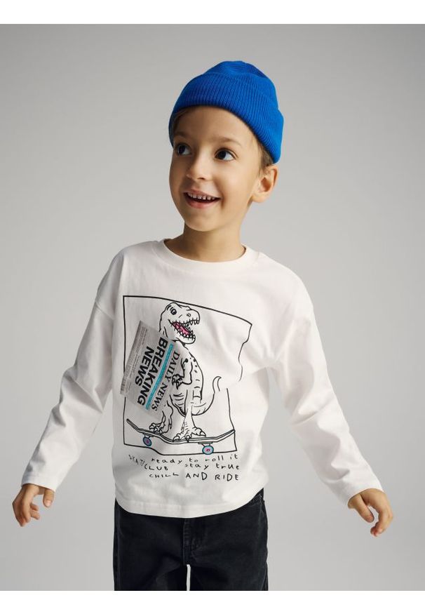 Reserved - Bawełniany longsleeve z nadrukiem - złamana biel. Materiał: bawełna. Długość rękawa: długi rękaw. Wzór: nadruk