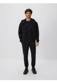 Reserved - Spodnie dresowe slim fit - czarny. Kolor: czarny. Materiał: dresówka