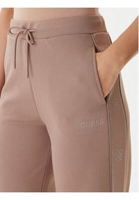 Guess Spodnie dresowe V5BB12 KCX22 Beżowy Wide Leg. Kolor: beżowy. Materiał: syntetyk #3