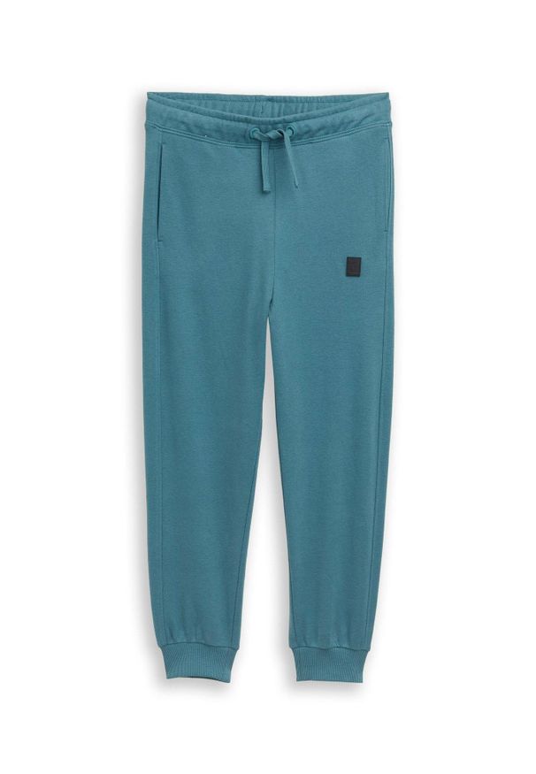 bonprix - Spodnie joggingowe marki Tom Tailor. Kolor: niebieski