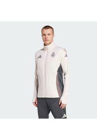 Adidas - Bezrękawnik Real Madrid Winterized. Kolor: fioletowy, brązowy, wielokolorowy, szary. Materiał: materiał. Długość rękawa: bez rękawów. Sport: piłka nożna