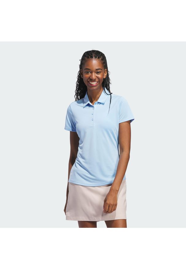 Adidas - Damska koszulka polo z krótkim rękawem Solid Performance. Typ kołnierza: polo. Kolor: niebieski. Długość rękawa: krótki rękaw. Długość: krótkie. Styl: klasyczny, sportowy