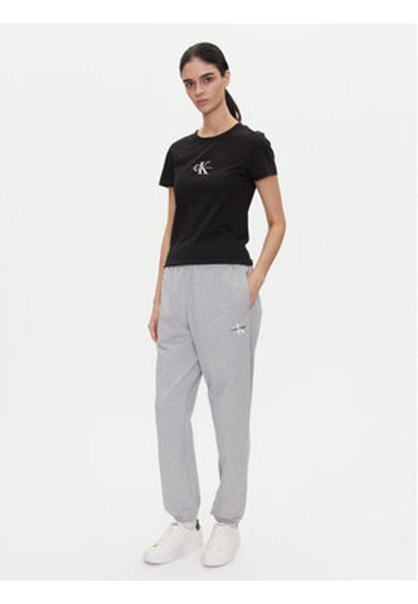 Calvin Klein Jeans Spodnie dresowe Monologo LV047B235G Szary Regular Fit. Kolor: szary. Materiał: bawełna