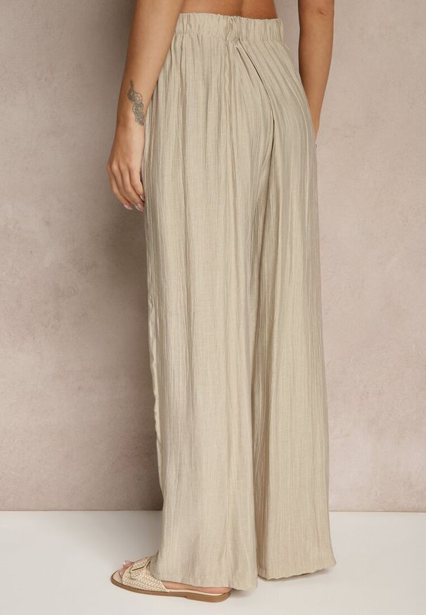 Renee - Beżowe Spodnie o Szerokim Kroju High Waist Natoreia. Okazja: na co dzień. Stan: podwyższony. Kolor: beżowy. Styl: boho, klasyczny, elegancki, casual