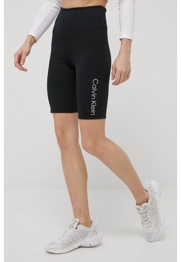 Calvin Klein Performance szorty treningowe CK Essentials damskie kolor czarny z nadrukiem high waist. Stan: podwyższony. Kolor: czarny. Materiał: skóra, dzianina. Wzór: nadruk
