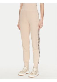 Guess Spodnie dresowe V2YB15 KB3P2 Beżowy Regular Fit. Kolor: beżowy. Materiał: bawełna