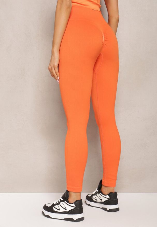 Renee - Pomarańczowe Legginsy High Waist Prążkowane Push-Up Sunflowia. Okazja: na co dzień. Stan: podwyższony. Kolor: pomarańczowy. Materiał: prążkowany. Styl: casual