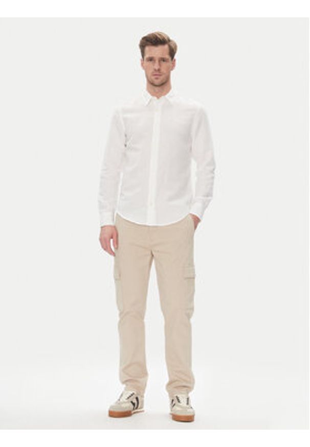 Pepe Jeans Spodnie materiałowe PM211907 Beżowy Slim Fit. Kolor: beżowy. Materiał: bawełna