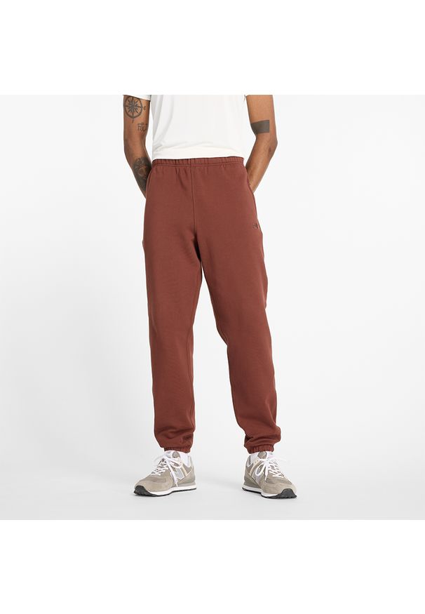 Spodnie męskie New Balance MP41508ROK – brązowe. Kolor: brązowy. Materiał: dresówka, bawełna, tkanina