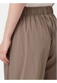 Adidas - adidas Spodnie dresowe Essentials Ripstop JD0783 Beżowy Loose Fit. Kolor: beżowy. Materiał: syntetyk #3