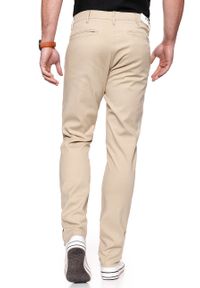 Wrangler - WRANGLER SPODNIE MĘSKIE CHINO CAMEL WASHED W16LHE49J. Materiał: materiał #9