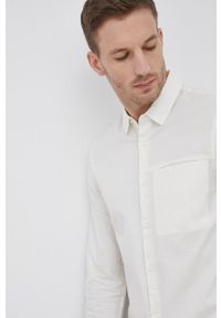 Calvin Klein Koszula bawełniana męska kolor kremowy slim z kołnierzykiem klasycznym. Typ kołnierza: kołnierzyk klasyczny. Kolor: beżowy. Materiał: bawełna. Wzór: gładki. Styl: klasyczny
