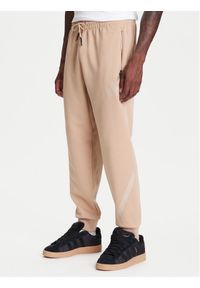 Adidas - adidas Spodnie dresowe Z.N.E. JW4725 Beżowy Loose Fit. Kolor: beżowy. Materiał: bawełna