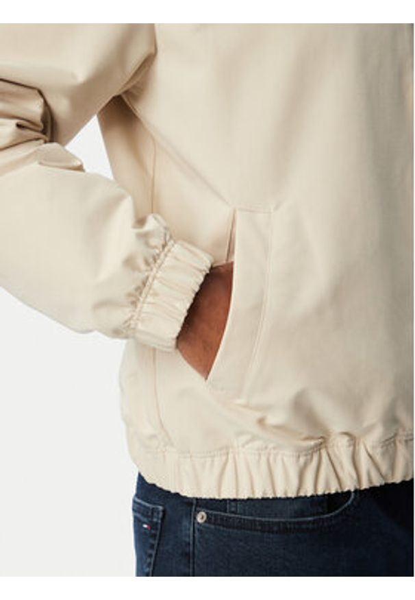 Tommy Jeans Kurtka przejściowa Essential DM0DM22720 Beżowy Regular Fit. Kolor: beżowy. Materiał: syntetyk