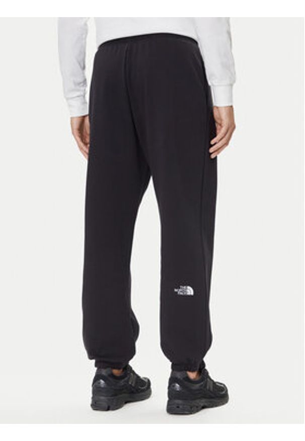The North Face Spodnie dresowe Essential NF0A8C1F Czarny Relaxed Fit. Kolor: czarny. Materiał: bawełna