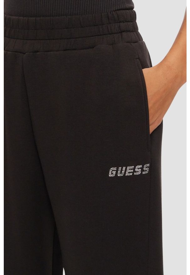 Guess - GUESS Czarne damskie spodnie dresowe Cecilia, Rozmiar S. Kolor: czarny. Materiał: dresówka