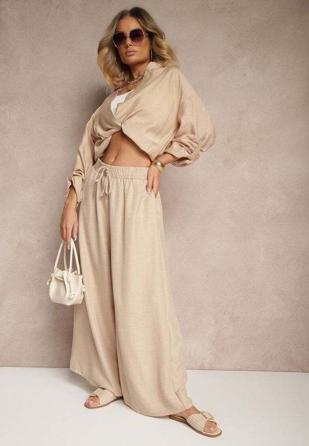 Renee - Beżowe Szerokie Spodnie High Waist Ozdobione Wiązaniem Telonia. Okazja: na co dzień. Stan: podwyższony. Kolor: beżowy. Wzór: aplikacja. Styl: casual, elegancki