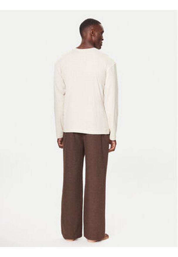 TOMMY HILFIGER - Tommy Hilfiger Spodnie materiałowe UM0UM03689 Brązowy Relaxed Fit. Kolor: brązowy. Materiał: bawełna